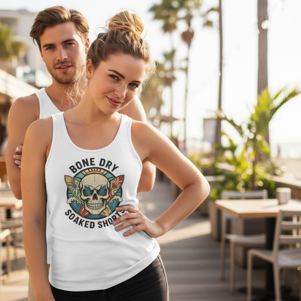 White unisex tank top with Bone Dry Soaked Shorts skull surf design, vintage surfboards, and cheeky Aussie humor by Cheeky Tees Co