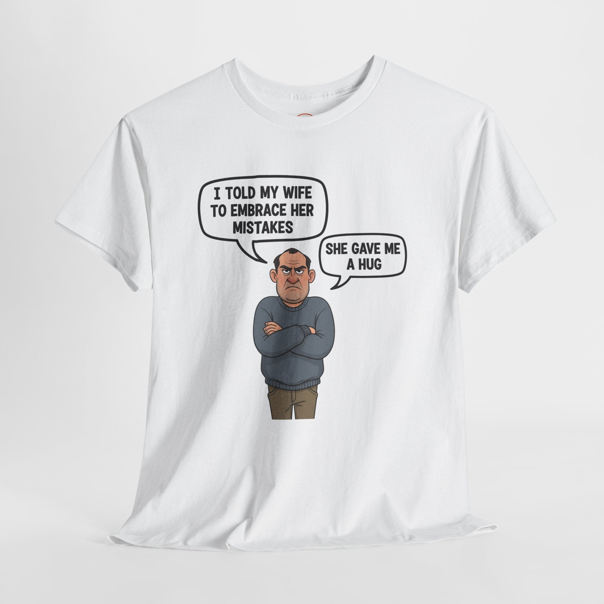 Cartoon husband with speech bubble “I told my wife to embrace her mistakes, she gave me a hug” – funny, inappropriate marriage joke t-shirt by Cheeky Tee Co